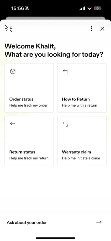AI chatbot welcome screen in the On Running app showing customer support options for order tracking, returns, and warranty claims
